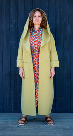 A MELODY COAT IN CHARTREUSE