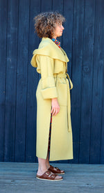 A MELODY COAT IN CHARTREUSE